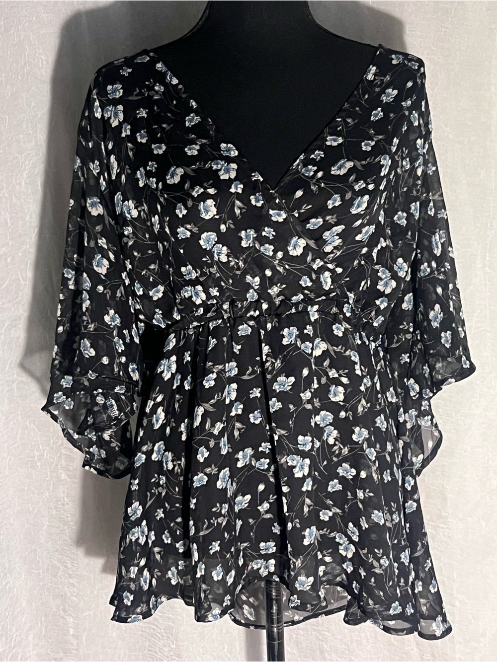 Black sheer v neck blouse with blue & white floral print